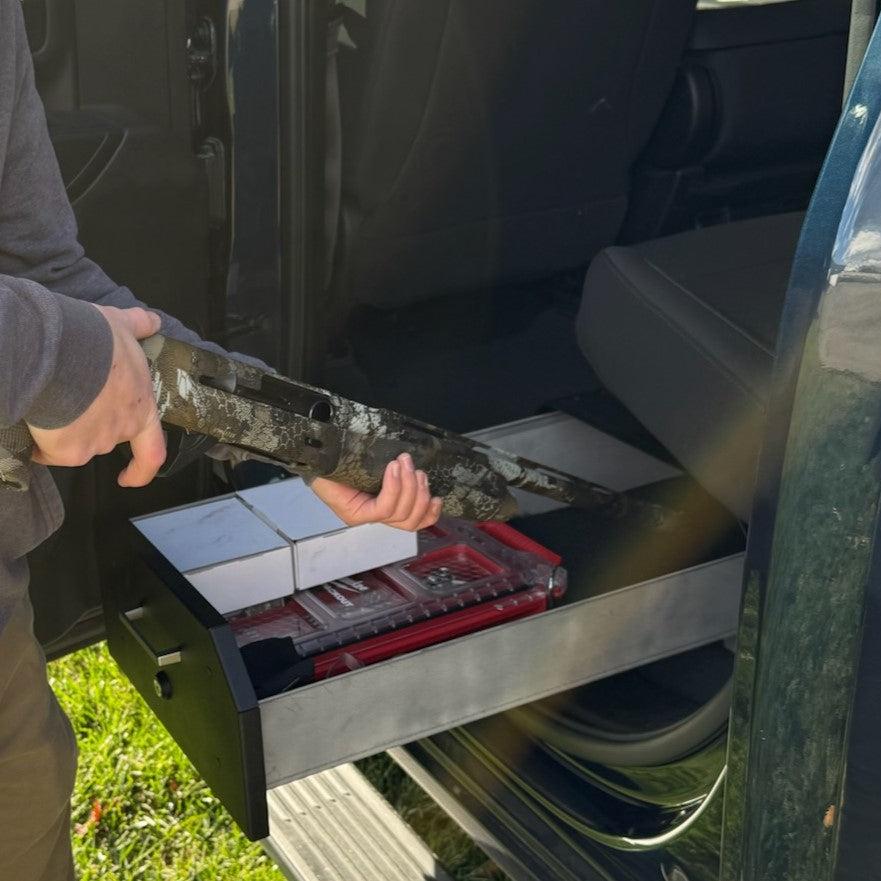 Ford Gear-Guard Under-Seat Locker with the door open with the carpet option showing how it can be used. The locker is a high-quality powder coated galvanealed steel.